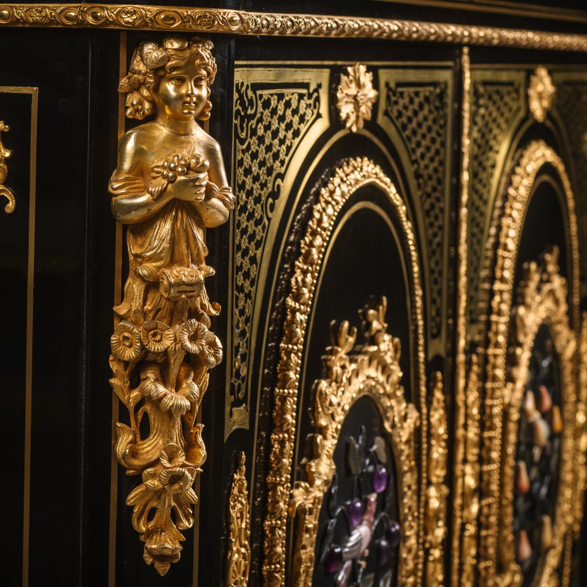 A Detail from A Napoleon III Gilt-Bronze and Hardstone Inset Ebonised Pier Cabinet