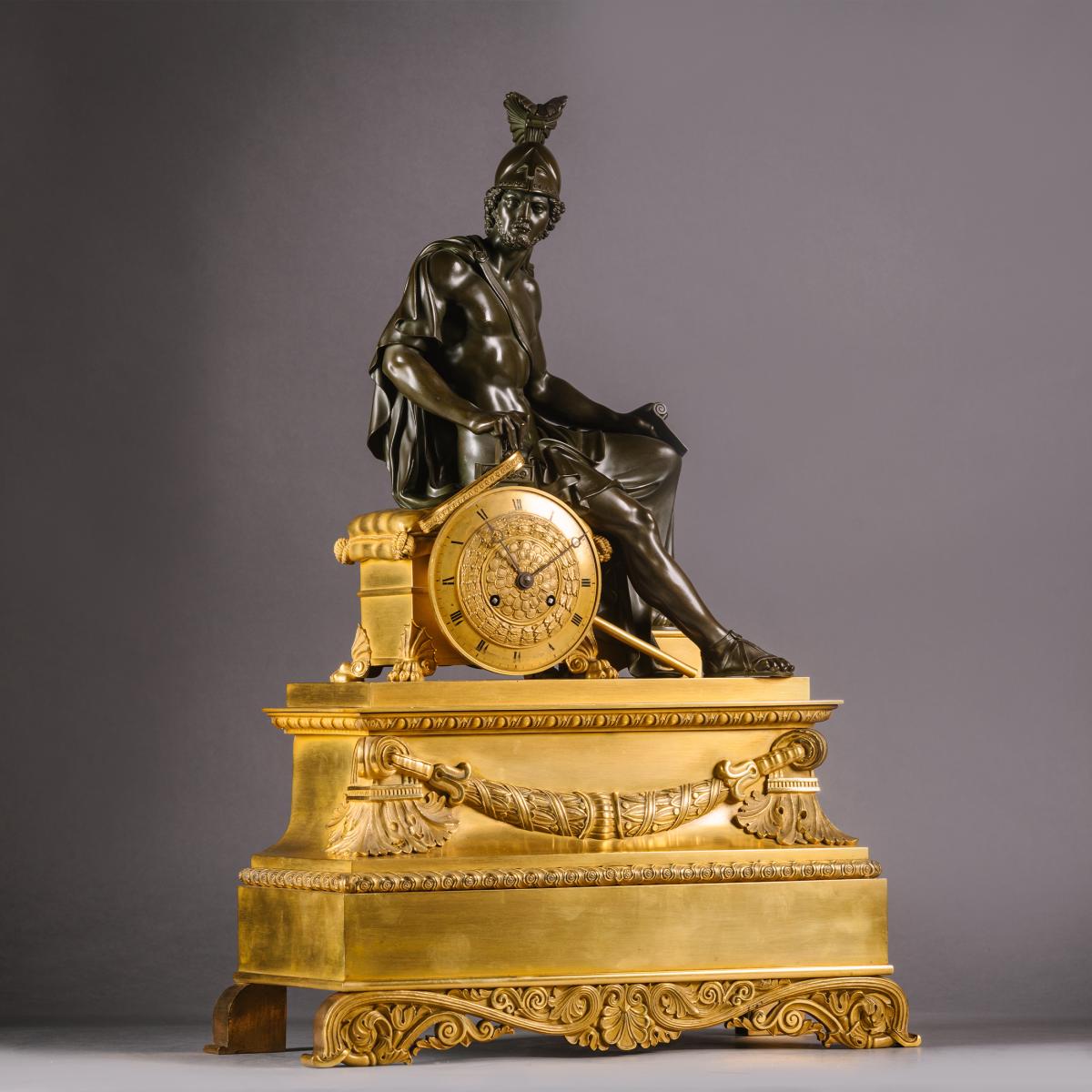 A Charles X Gilt and Patinated Bronze Figural Mantel Clock 