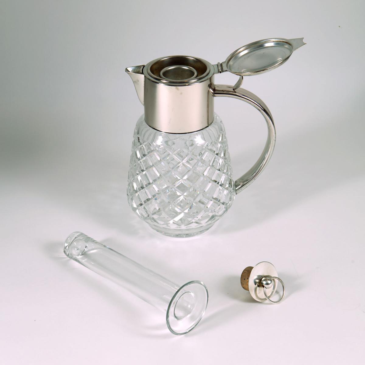 silver plated and cut glass serving jug
