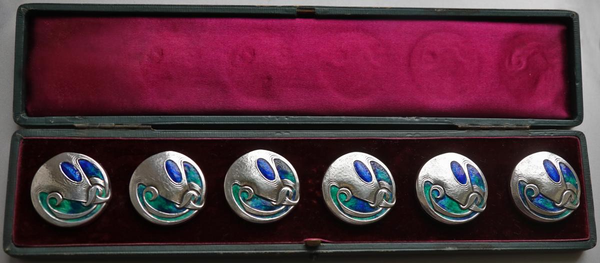 Archibald Knox six large Liberty & Co cased silver & enamel buttons