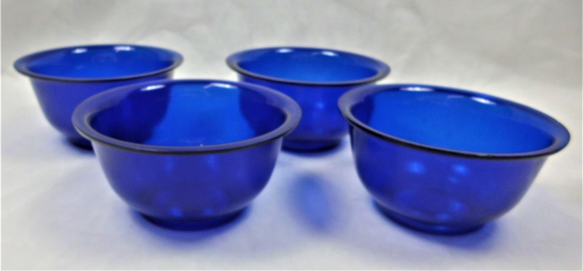 Four blue cast Peking glass bowls, Chinese circa 1900