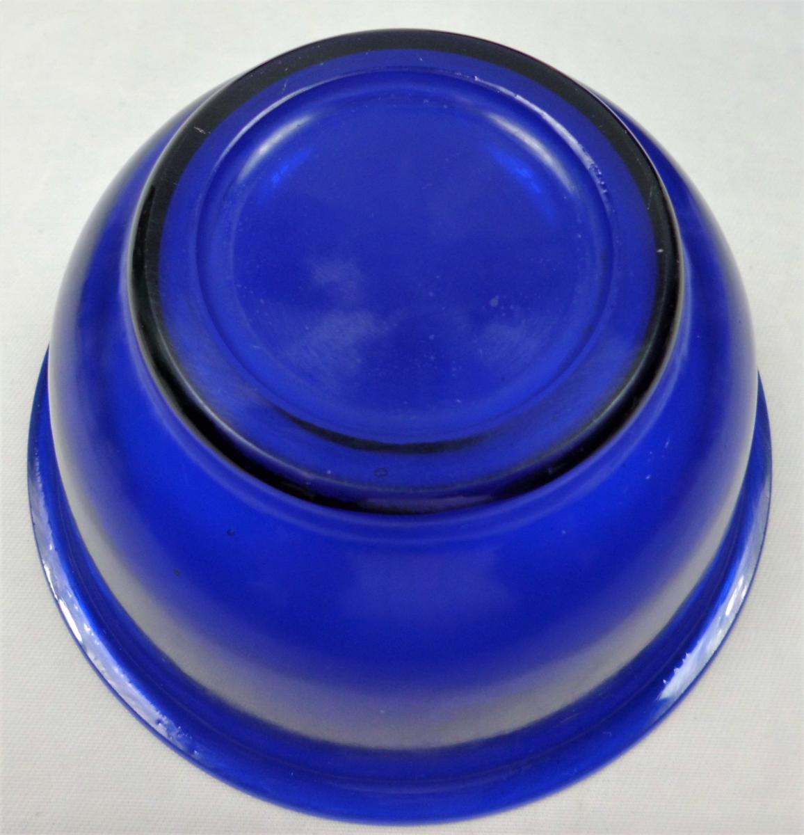 Four blue cast Peking glass bowls, Chinese circa 1900