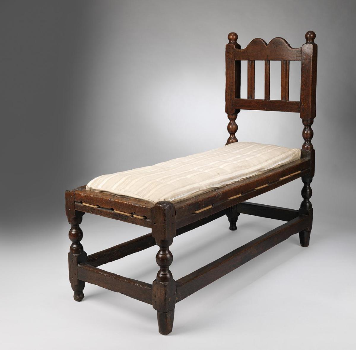 Rare Small William and Mary Period Joined Frame Day Bed The Graphic Ogee Cresting Flanked by Ball Finials and Raised on Turned Legs Solid Naturally Patinated Oak English, c.1680