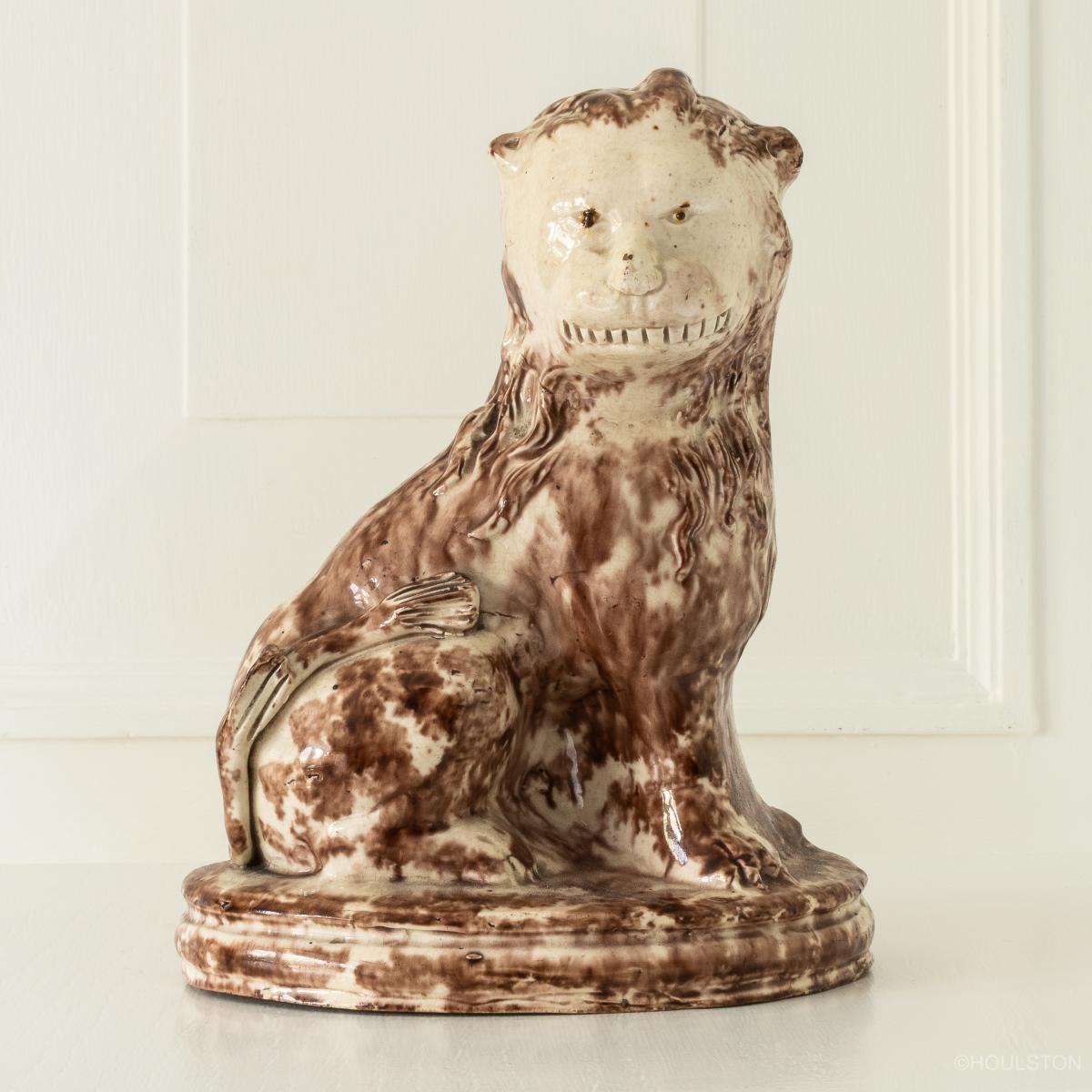 An 18th century creamware figure of a lion