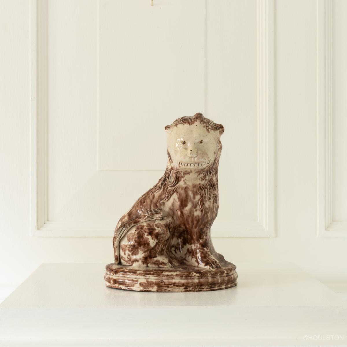 An 18th century creamware figure of a lion