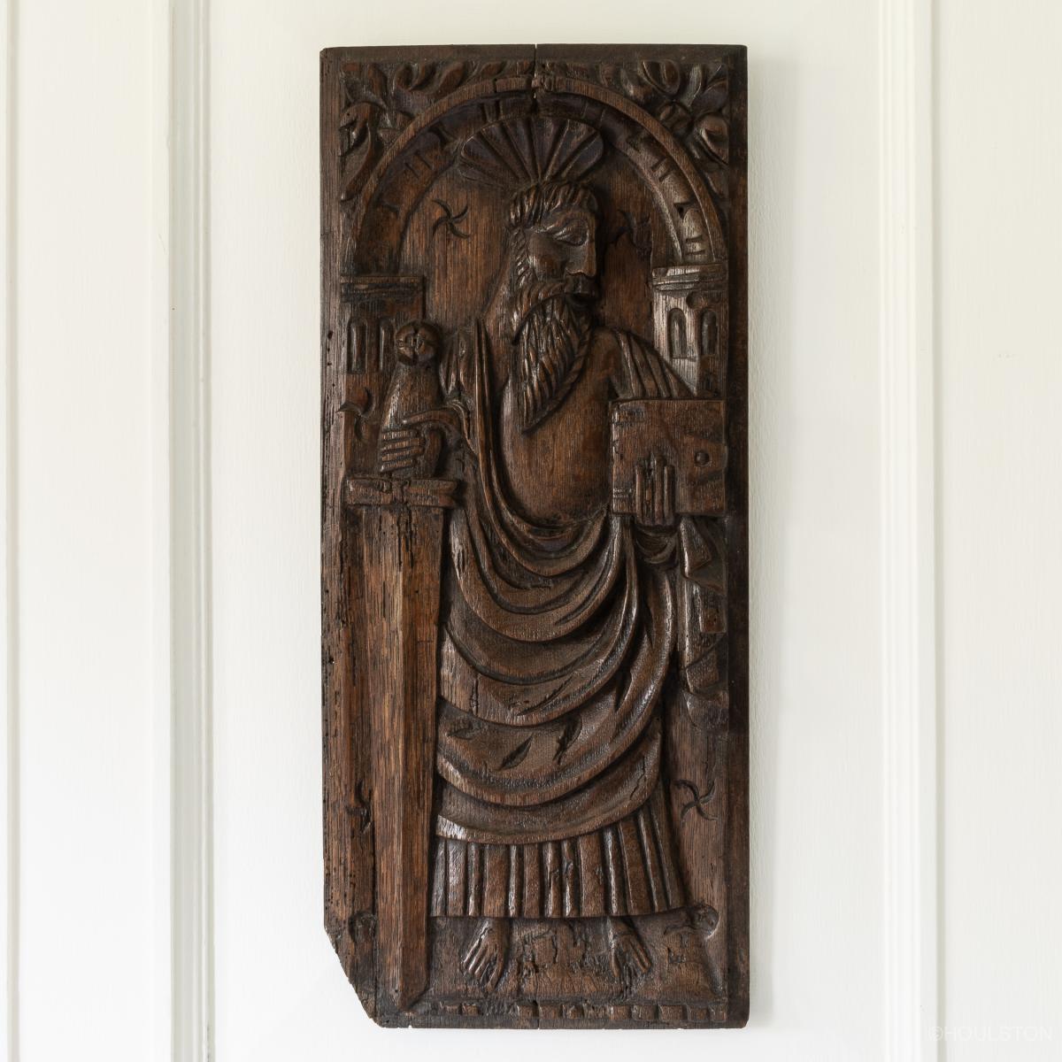 An early 16th century carved panel of Saint Paul