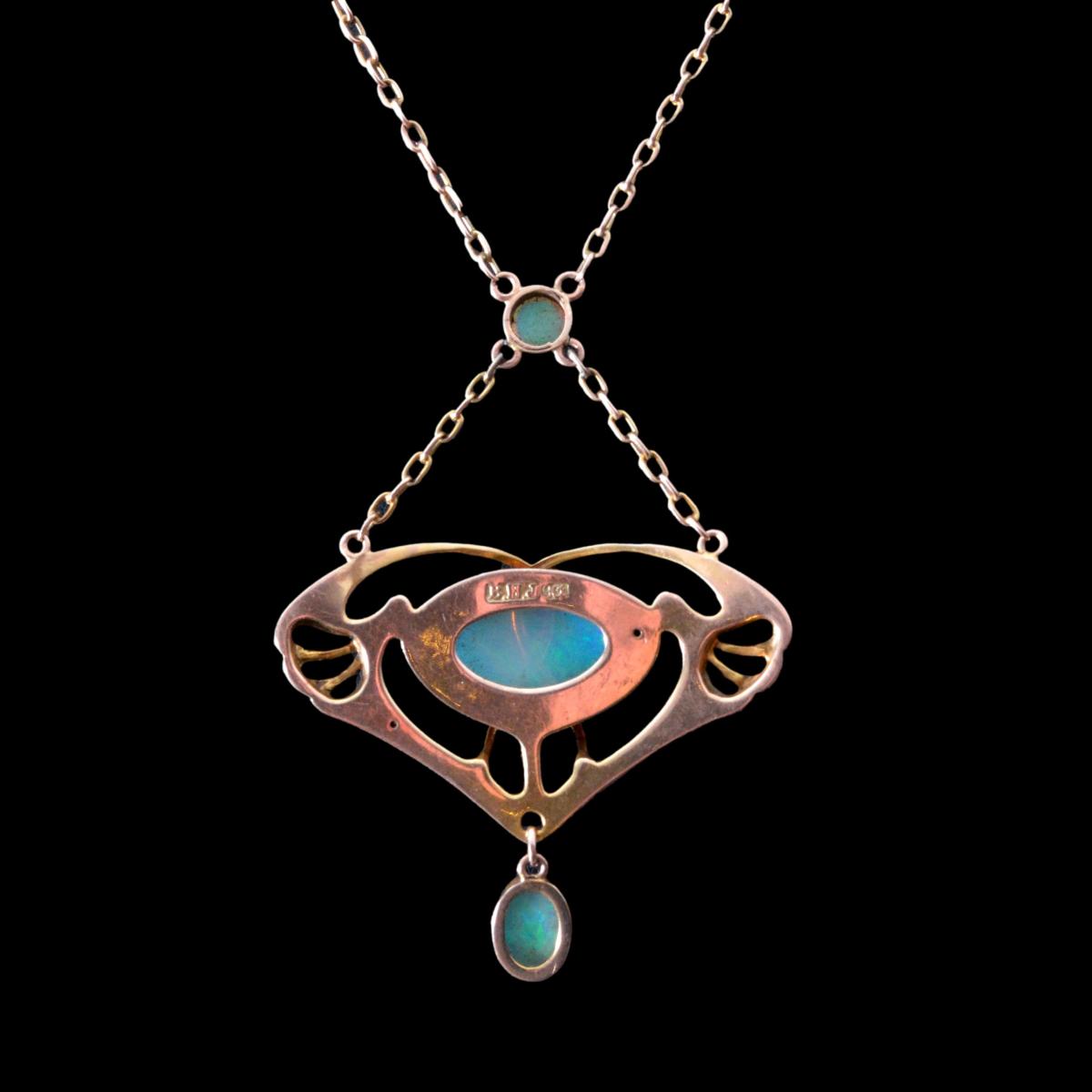 A Barnet Henry Joseph gold and opal pendant