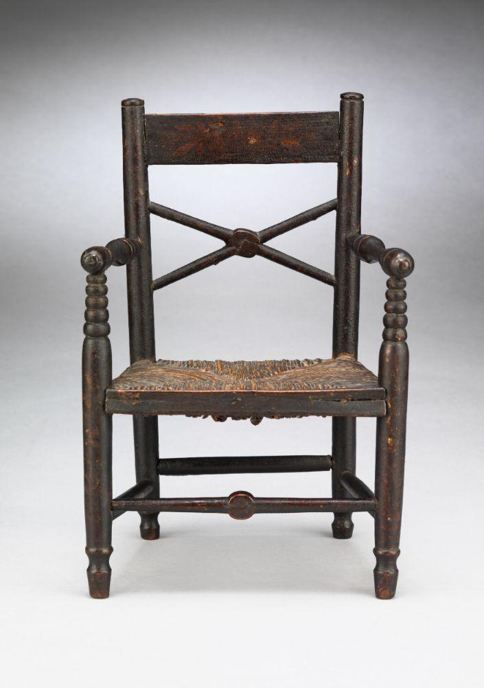 Rare Miniature Paint Decorated Vernacular Armchiar  With Broad Crest Rail above "X" Spindle Back  Turned and Painted Wood with Rush Seat  British, c.1850