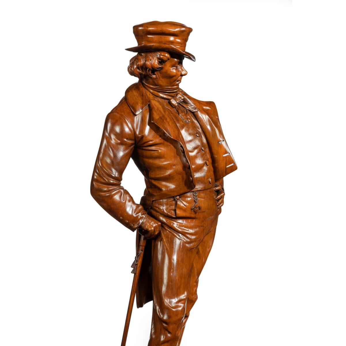 A Victorian carved walnut figure of a fashionable gentleman