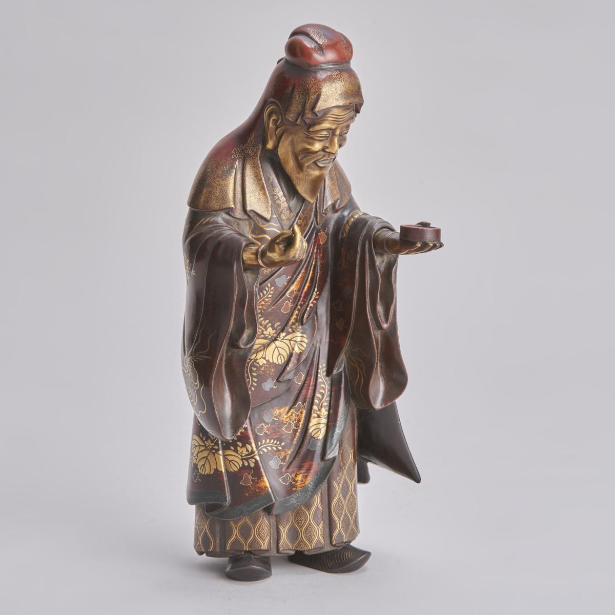 A beautiful lacquered wood Okimono depicting Jurojin (One of the Seven lucky Gods)