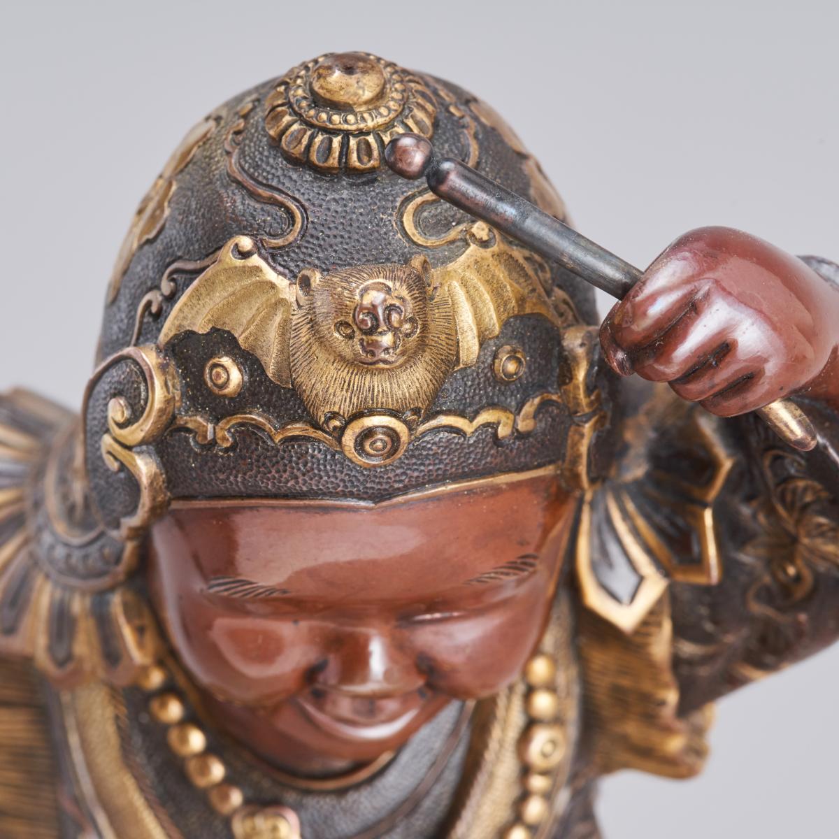 Japanese bronze boy with a festival headdress signed Miyao, Meiji Period