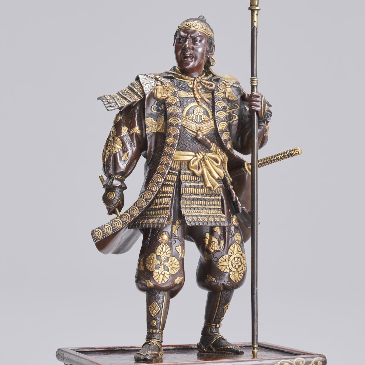 Japanese bronze Samurai with naginata and wearing kabuto signed Miyao Eisuke, Meiji Period