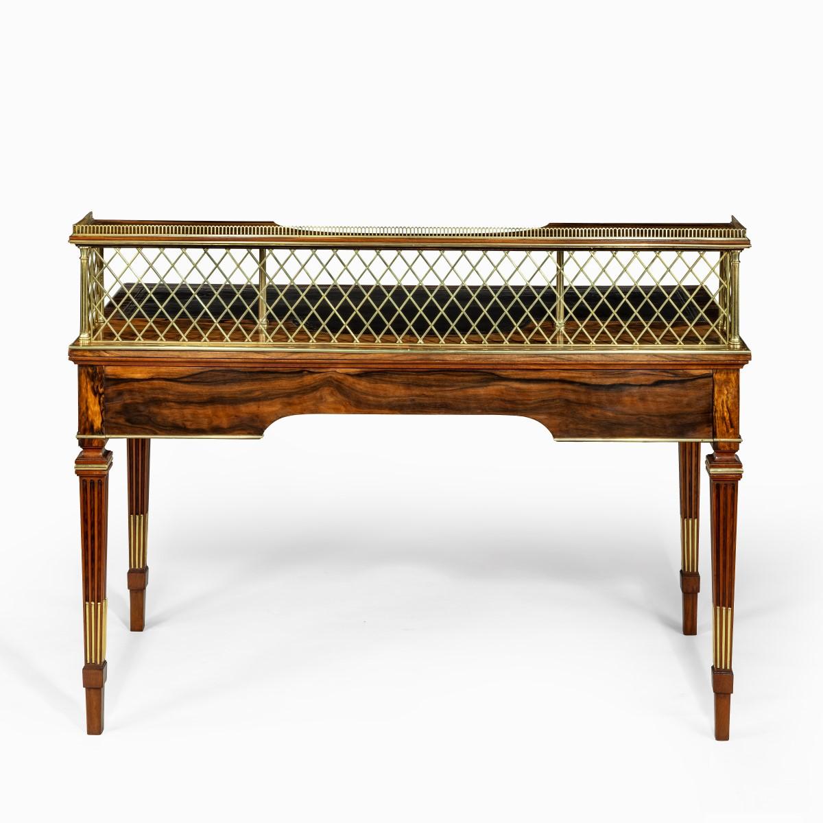 An olivewood writing table by Wright and Mansfield