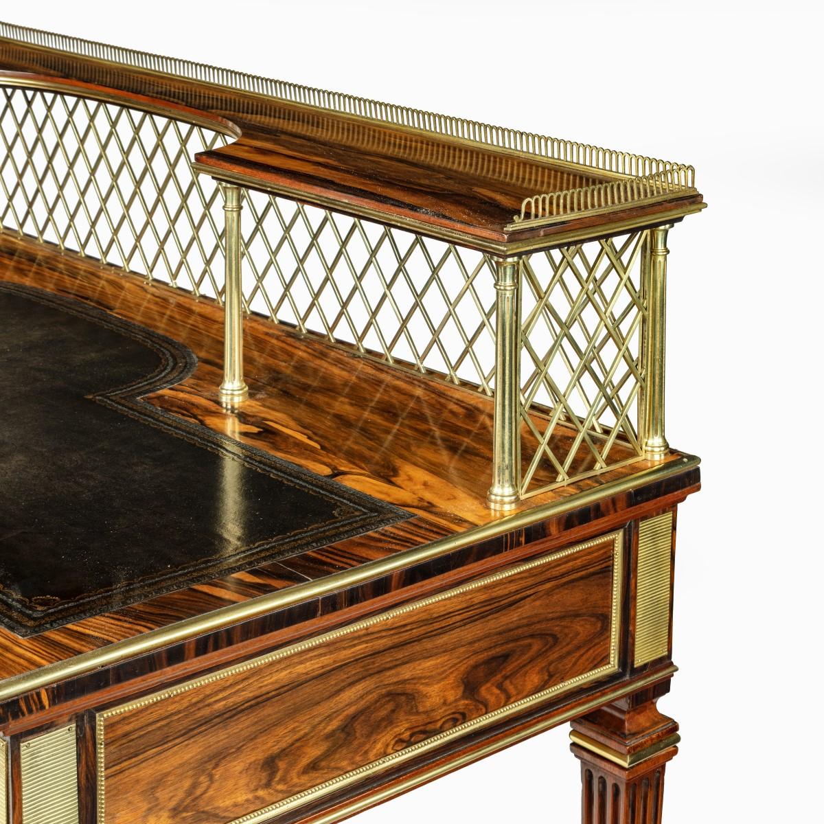 An olivewood writing table by Wright and Mansfield