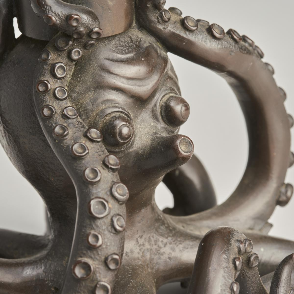 An amusing pair of Bronze and multi-metal vases supported by Octopuses
