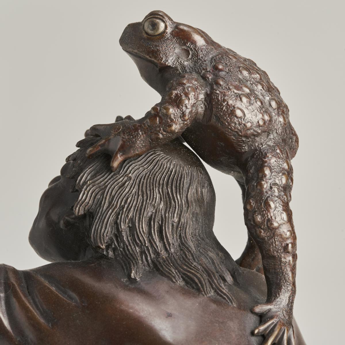 An amusing Bronze Okimono of Gama Sennin with a group of large toads