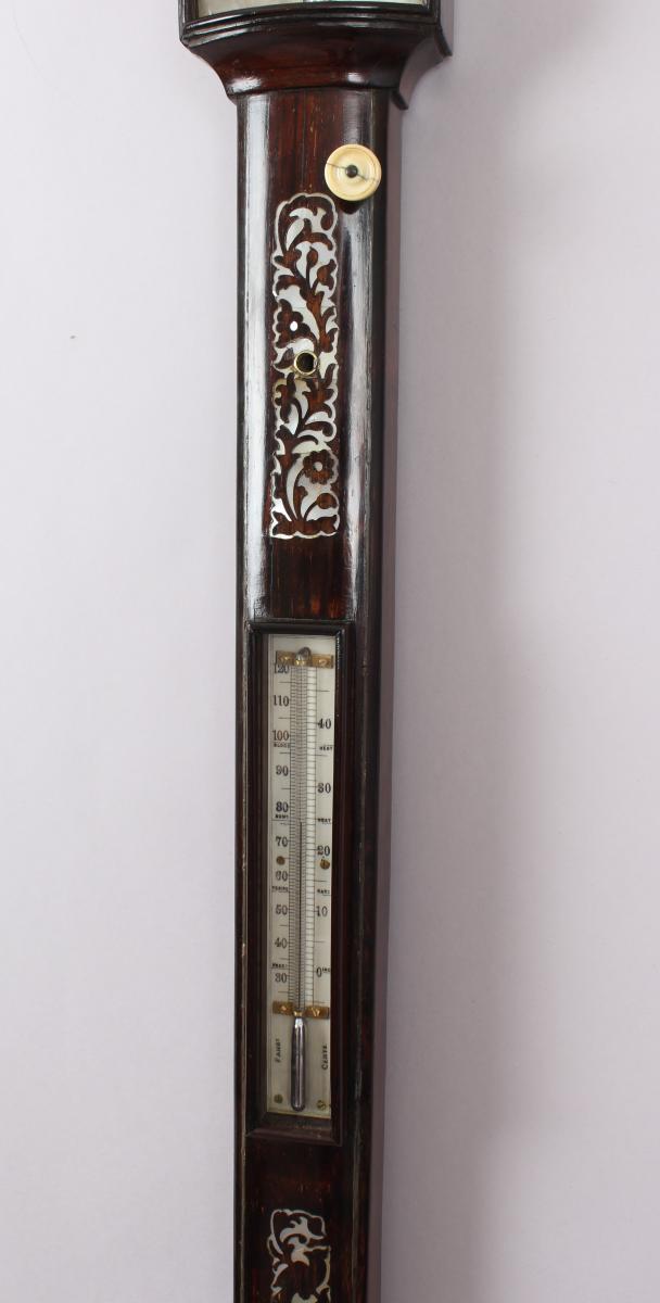 A bow-fronted marine barometer in a well-figured rosewood case 