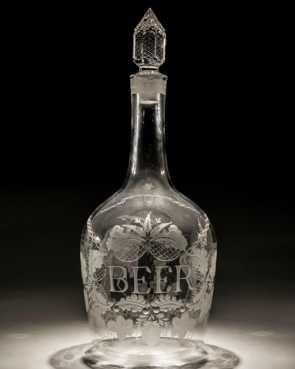 An Elaborate Engraved George III Magnum Beer Decanter