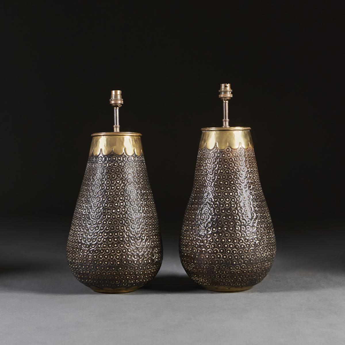 A Pair of Punched Metal Lamps with Brass Scallop Rims