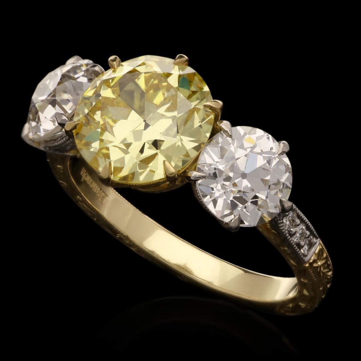 old cut fancy coloured diamond and white diamond three stone ring