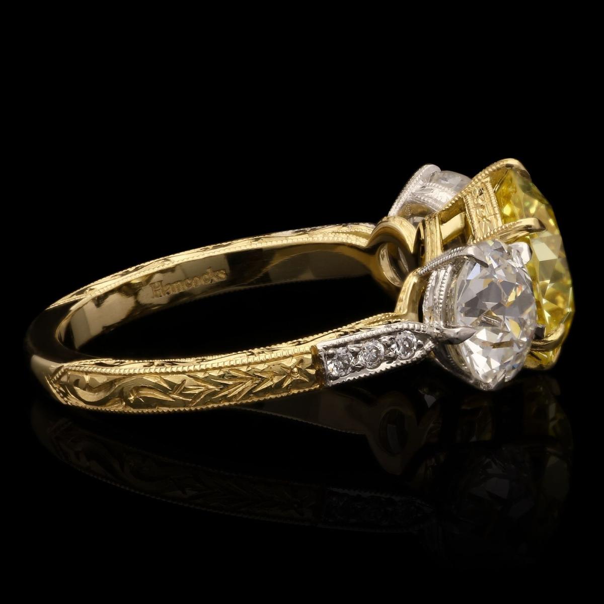 old cut fancy coloured diamond and white diamond three stone ring