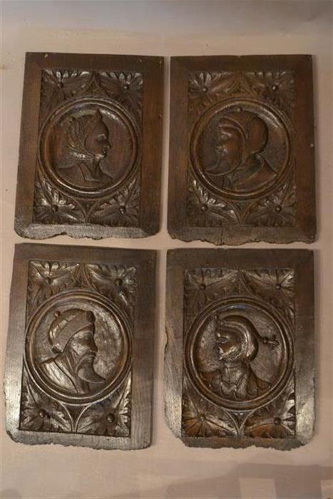 A good set of four Romayne Head oak panels