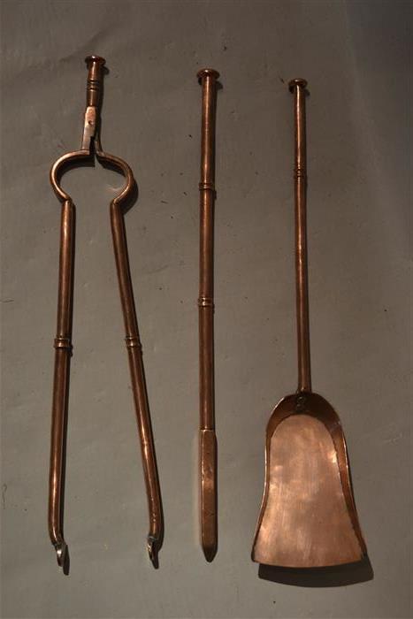 A fine set of solid copper Georgian fire irons