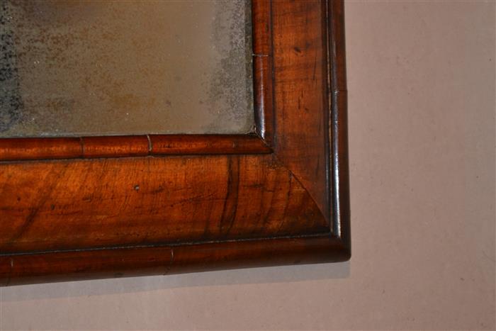 A Queen Anne walnut cushion frame mirror