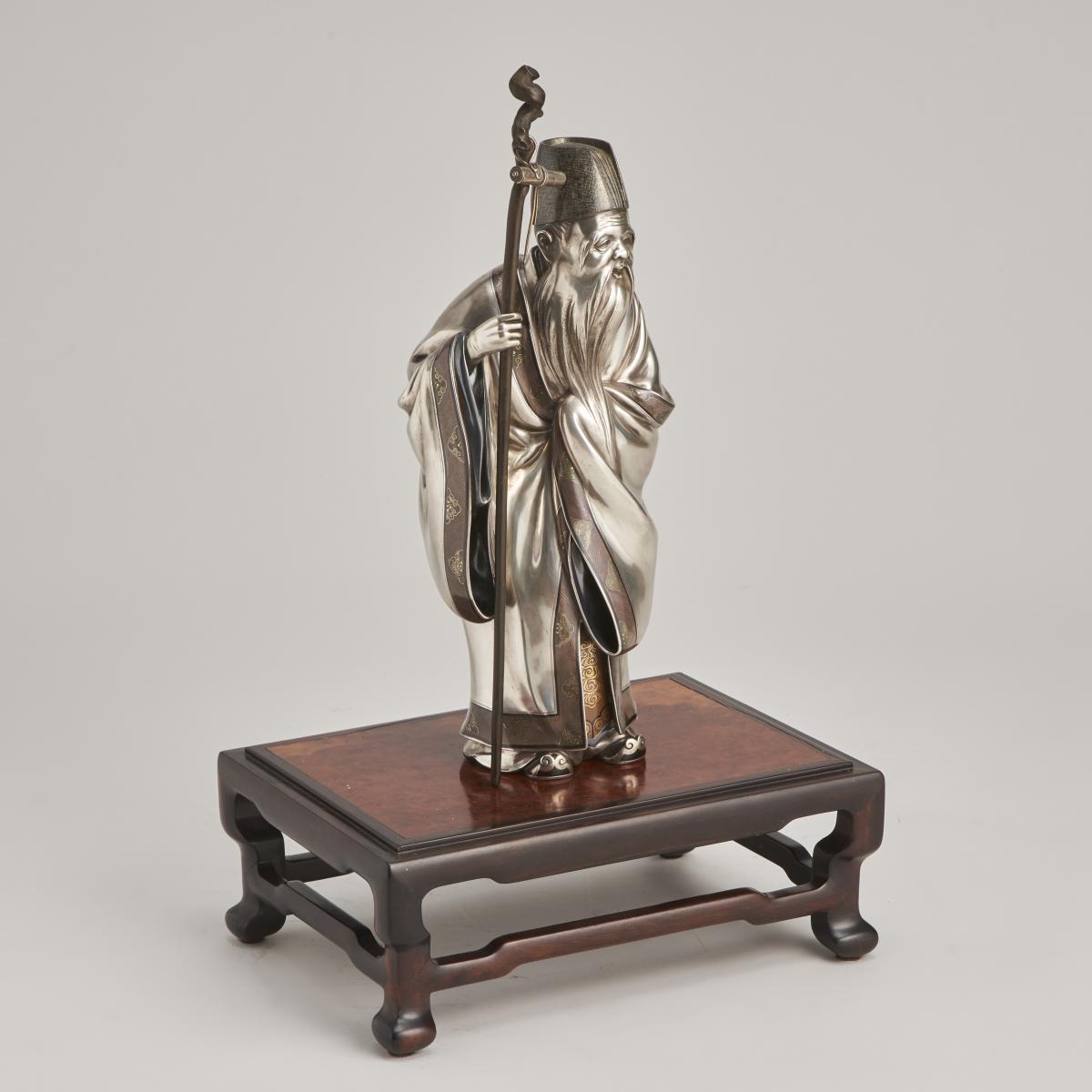 A serene, Japanese Meiji-era Silver Okimono of Jurojin (One of the 7 Lucky Gods)