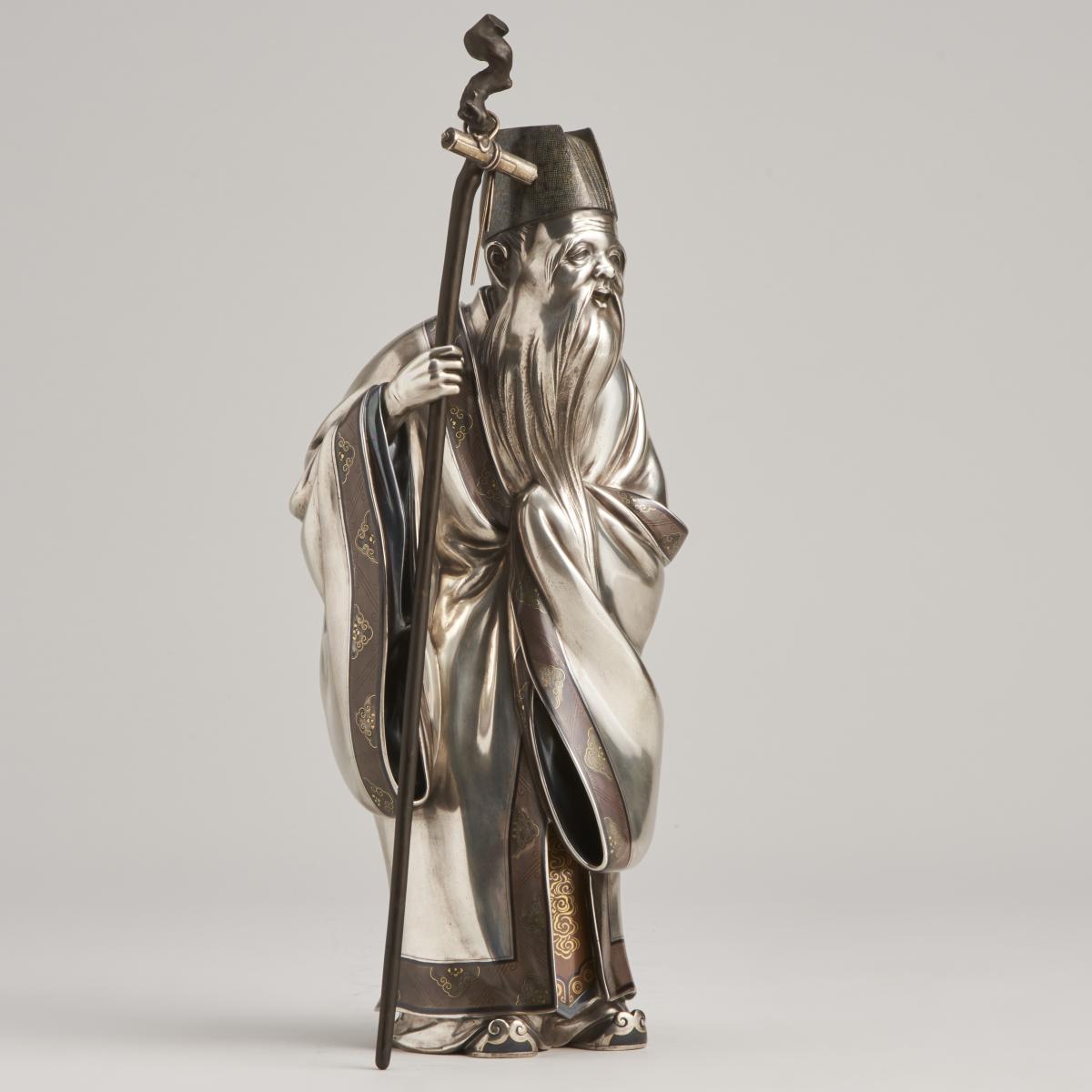 A serene, Japanese Meiji-era Silver Okimono of Jurojin (One of the 7 Lucky Gods)