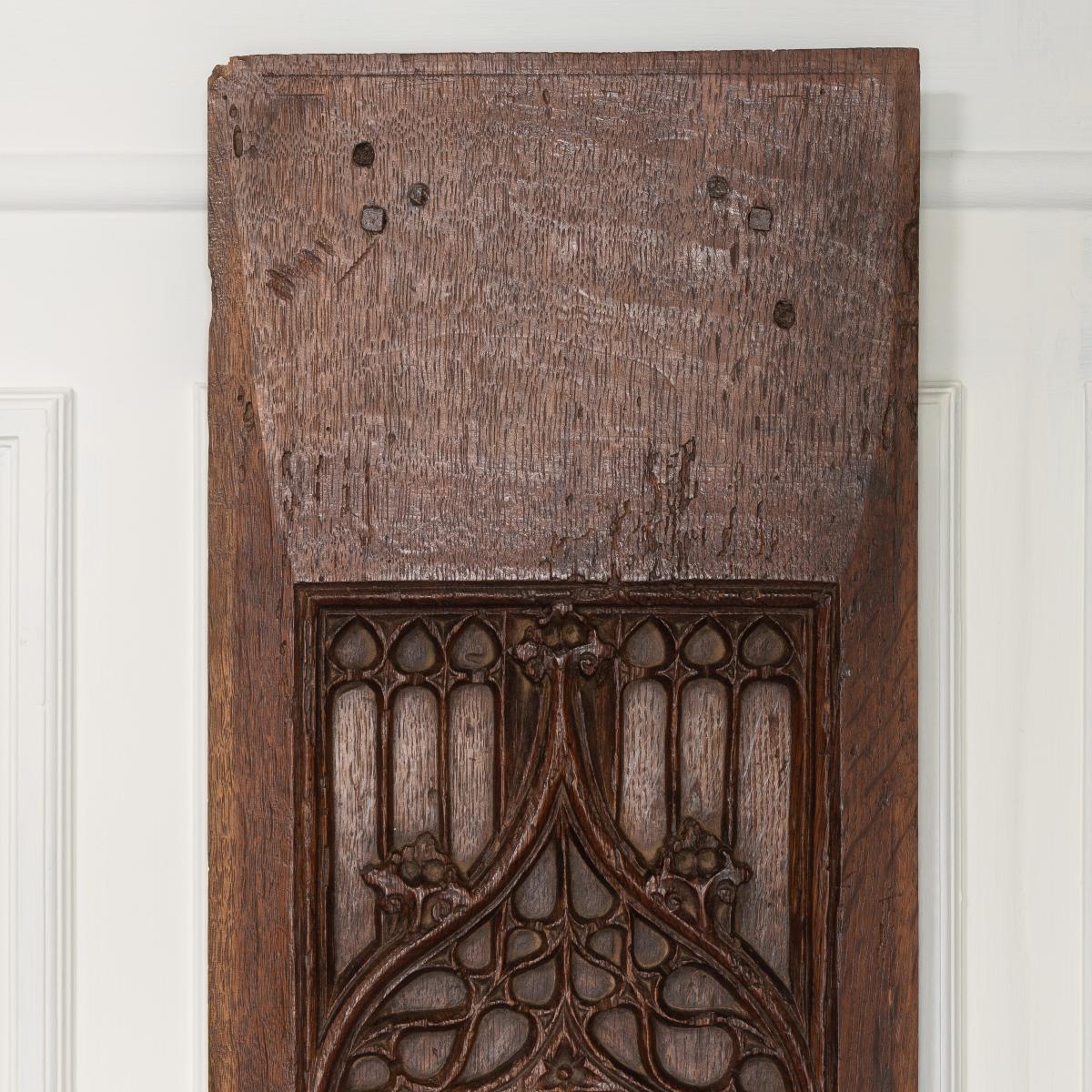 A late medieval carved oak panel, detail