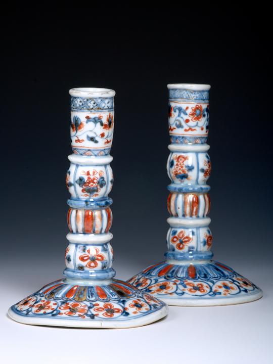 Pair of Chinese export porcelain candlesticks of European silver form, Kangxi