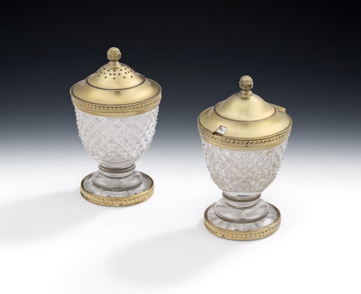 A silver gilt mounted cut glass Mustard Pot and Pepper made in London in 1962 by Asprey & Company Ltd