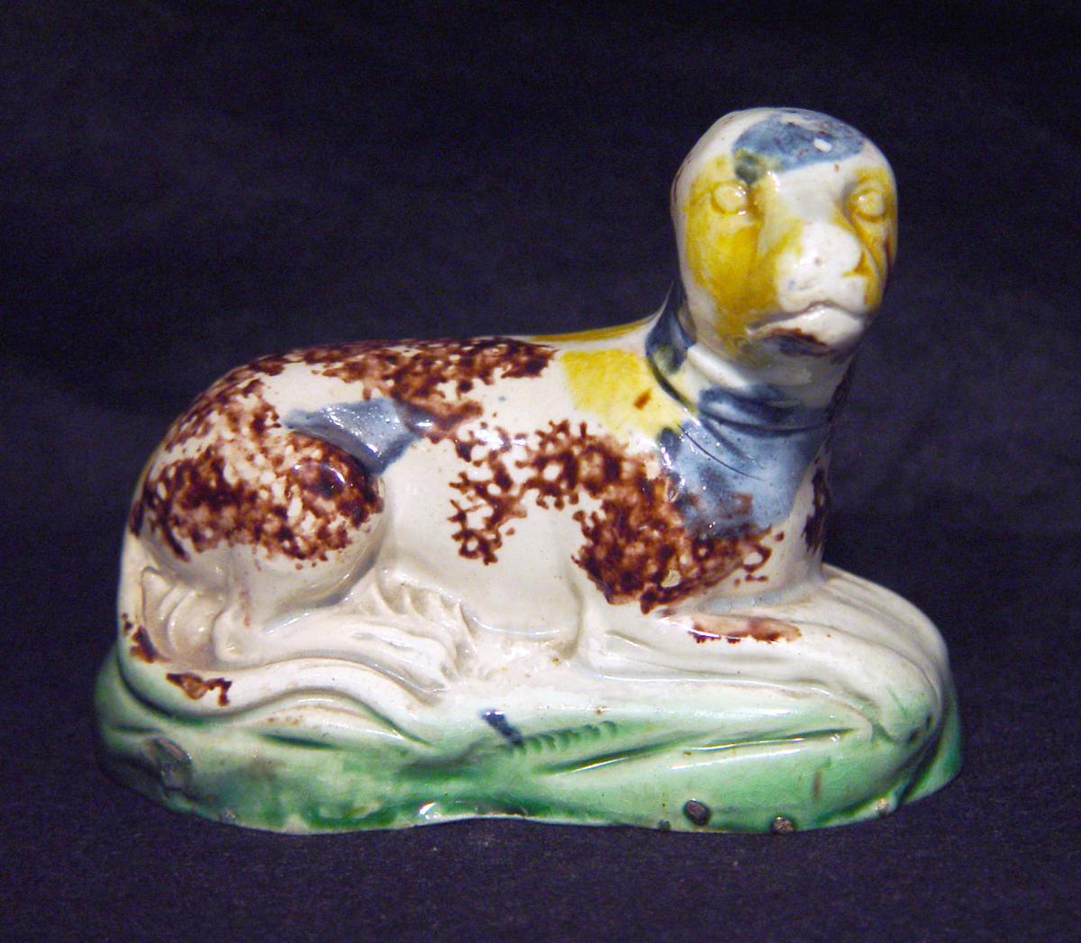 Creamware Whieldon-type Pottery Recumbent Dog, Circa 1775.
