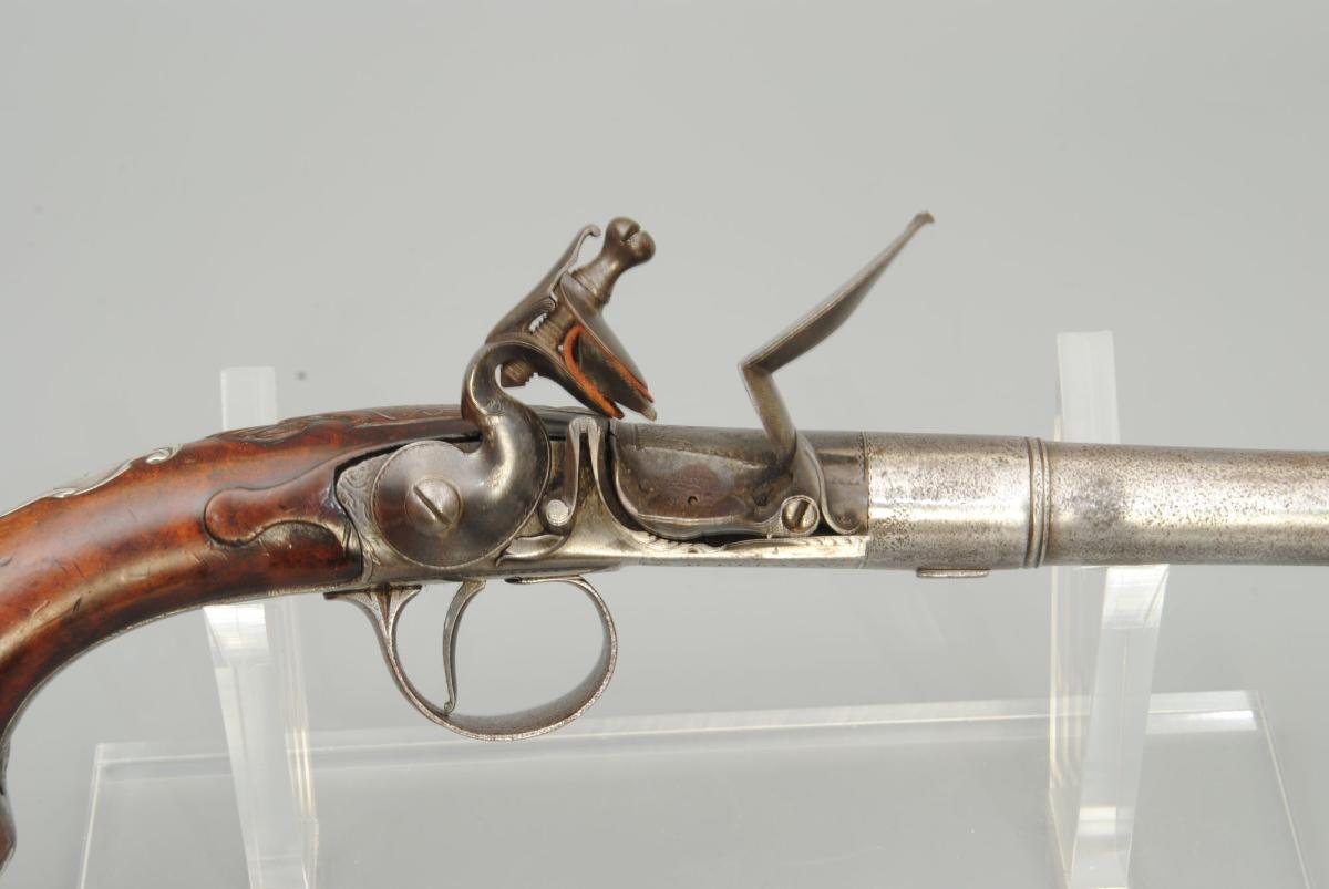 A Pair Of 18th Century 22 Bore Silver Mounted Turn Off Barrel Pistols.