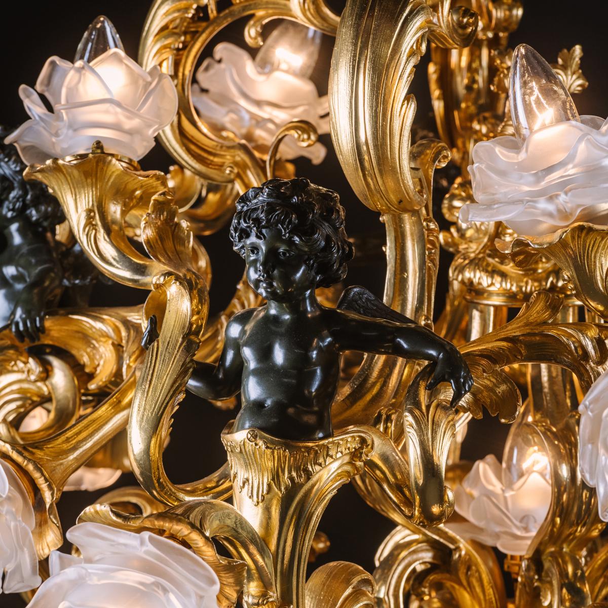 An Impressive Belle Epoque Gilt and Patinated Bronze Twenty-One Light Chandelier