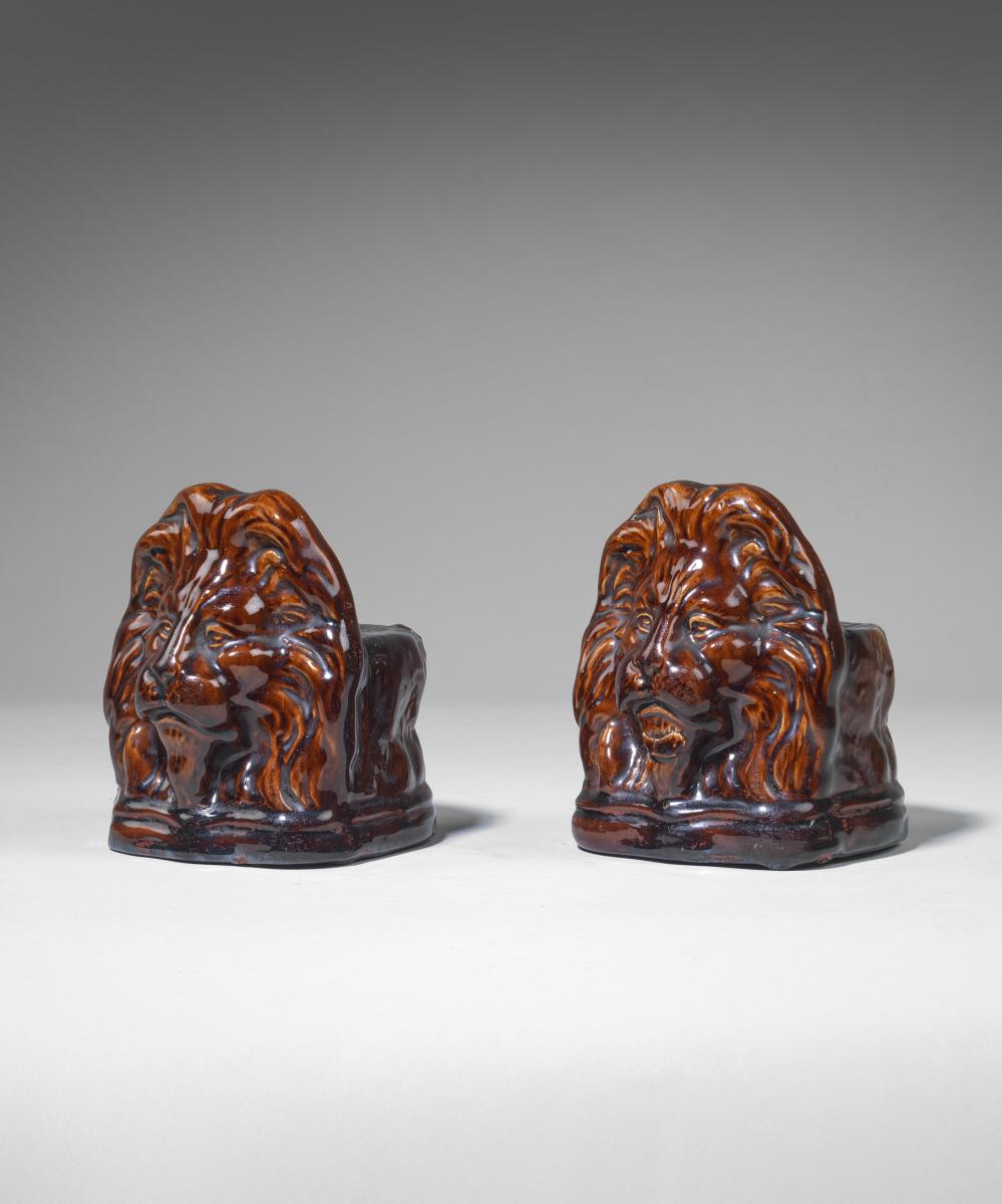 Nineteenth Century ceramic lion sash stops