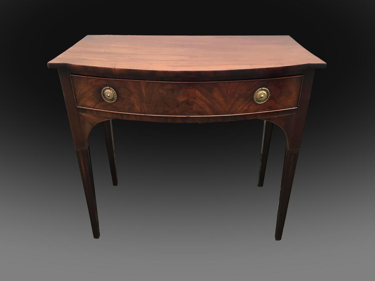 George III bow front mahogany table