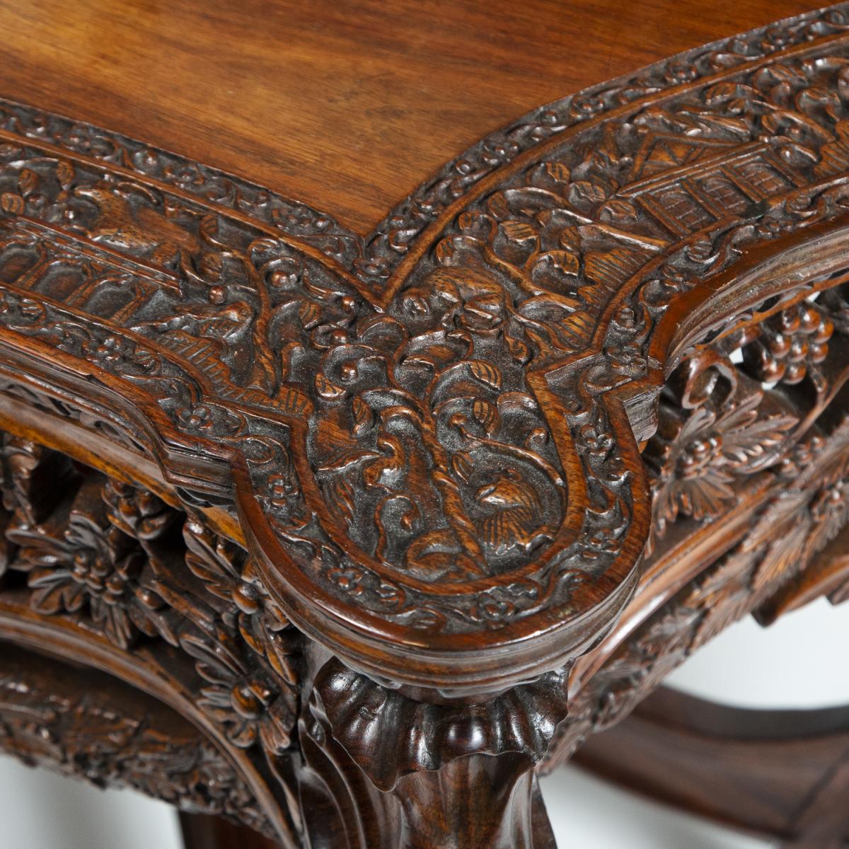 Late 19th century highly carved teak console table