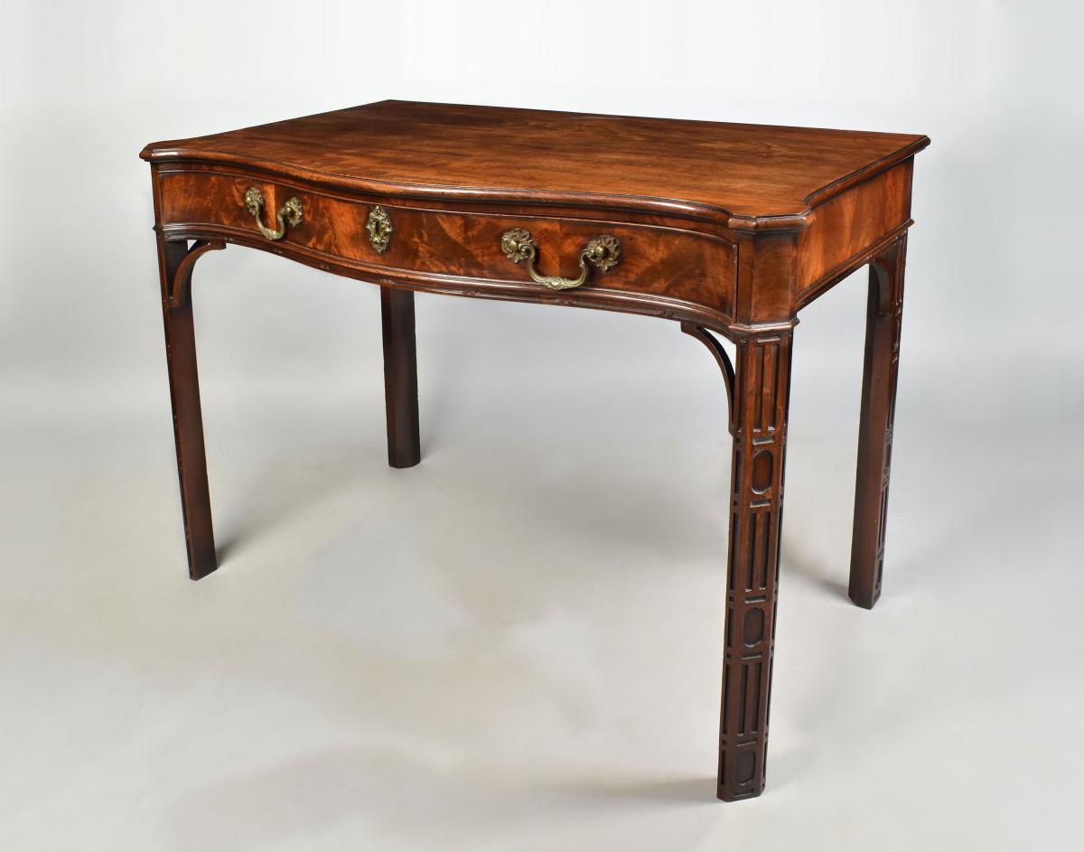 A finely detailed Chippendale period serpentine mahogany sidetable in original condition, c.1770