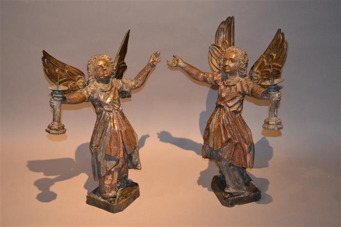 A rare pair of carved and polychromed angels