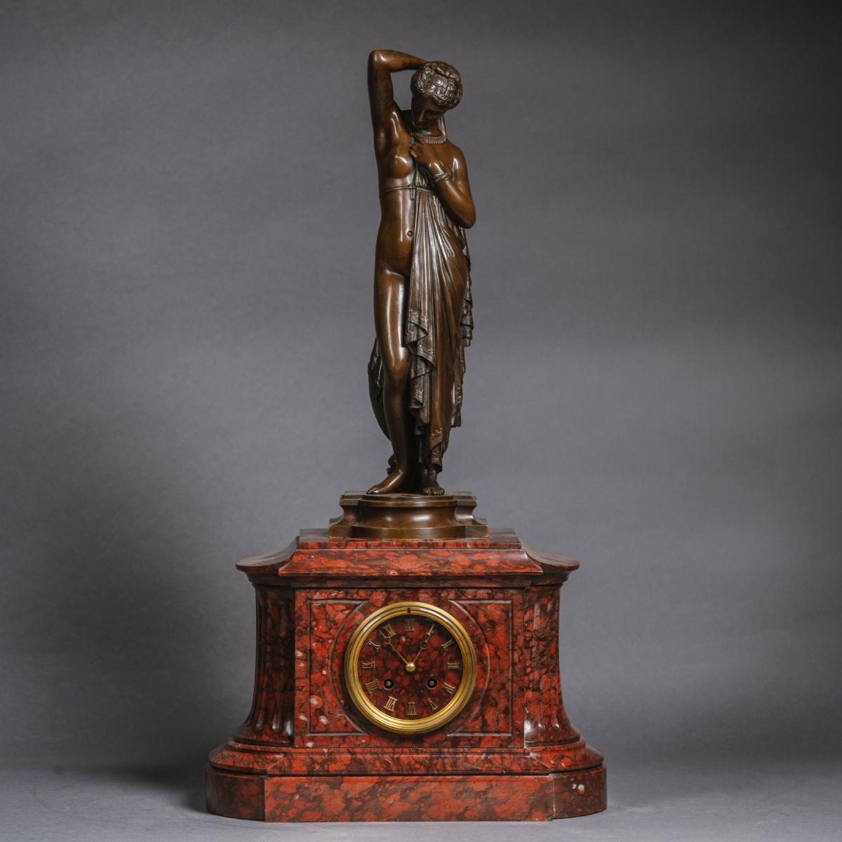 A Napoléon III Marble Mantle Clock With A Patinated Bronze Figure of 'Phryné' by James Pradier