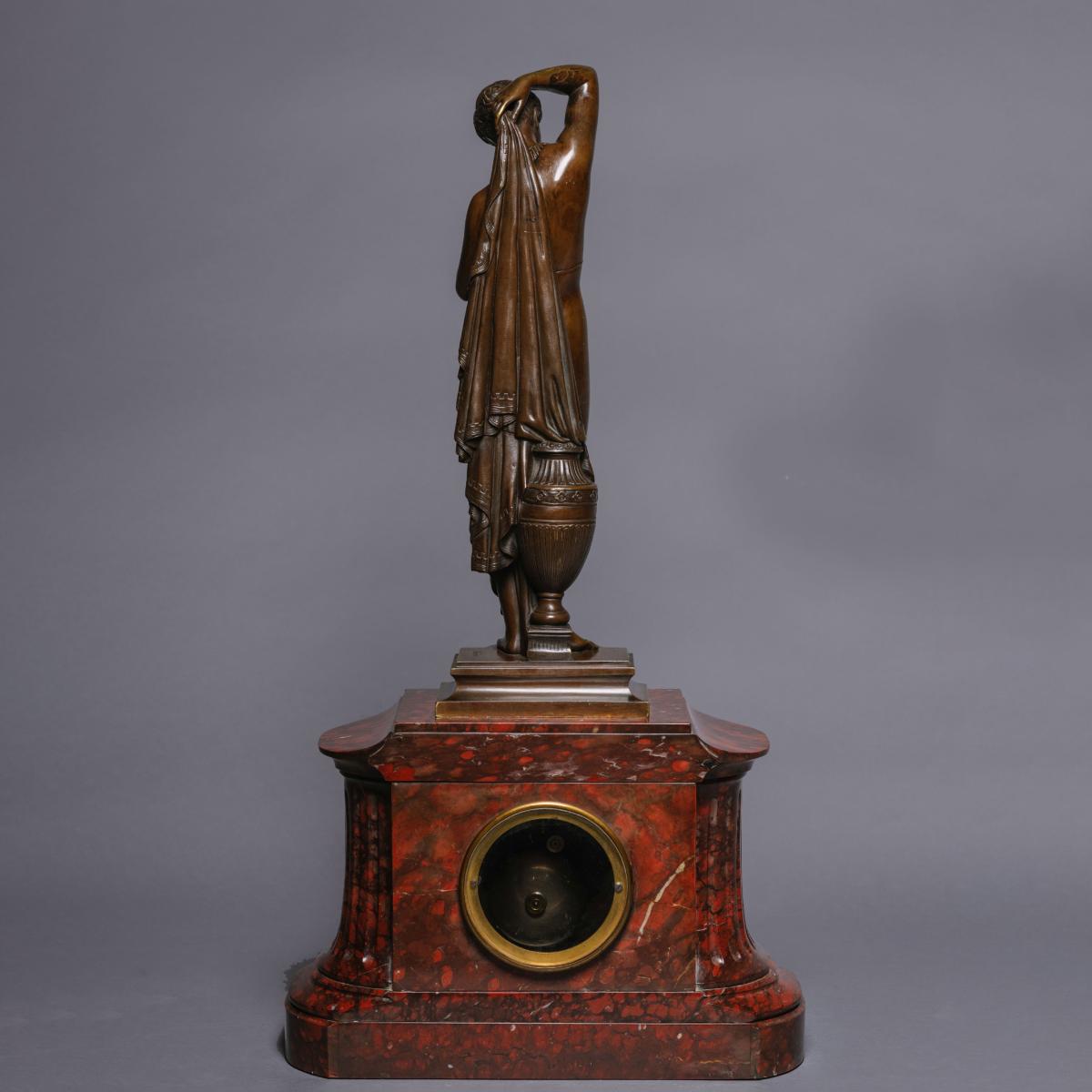 A Napoléon III Marble Mantle Clock With A Patinated Bronze Figure of 'Phryné' by James Pradier