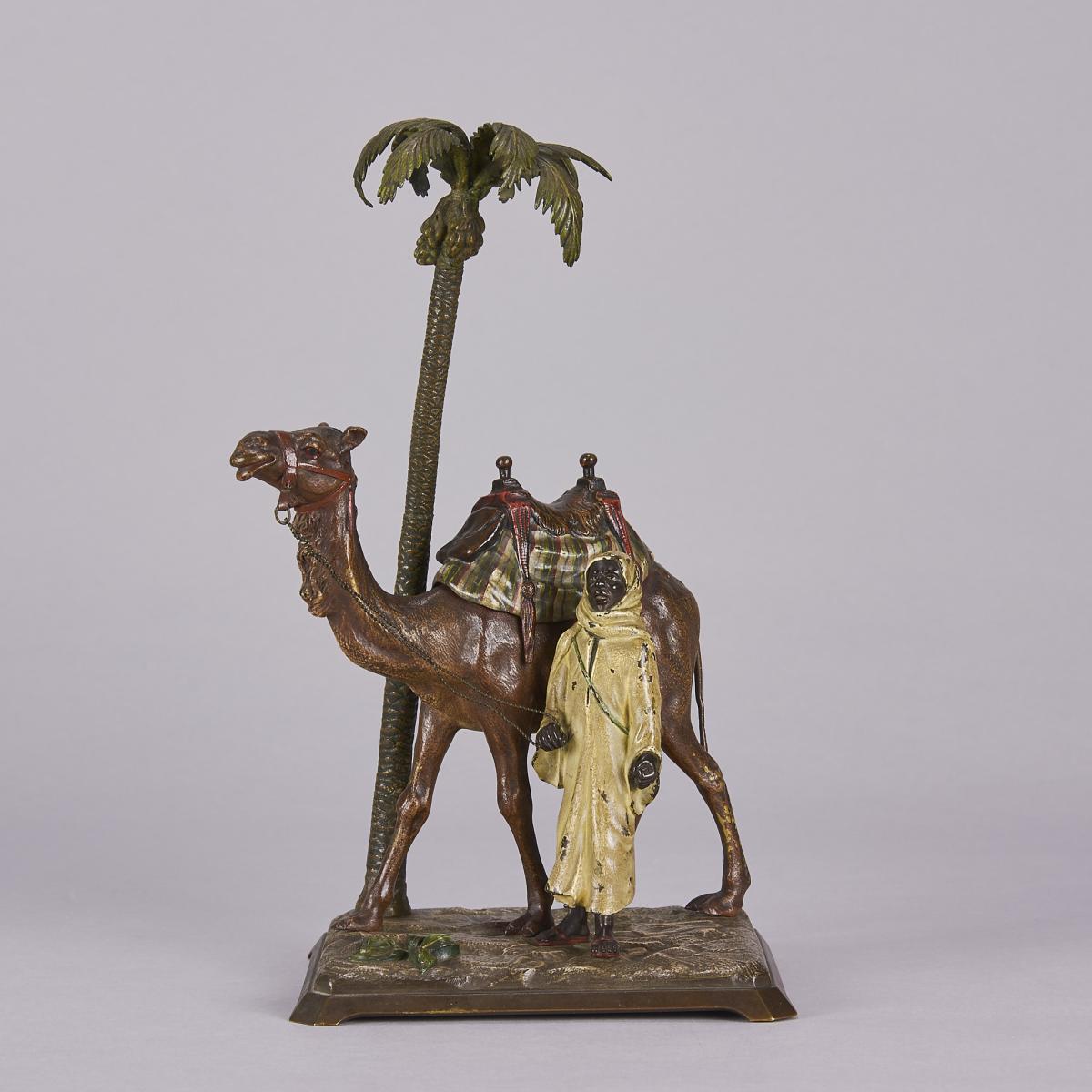 Cold-Painted Austrian Bronze entitled "Bedouin with Camel under Palm Tree" by Franz Bergman