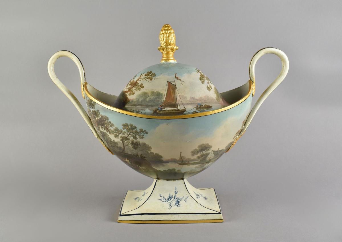 Pair late eighteenth century tole boat shaped urns and covers painted with watery landscapes, c.1790