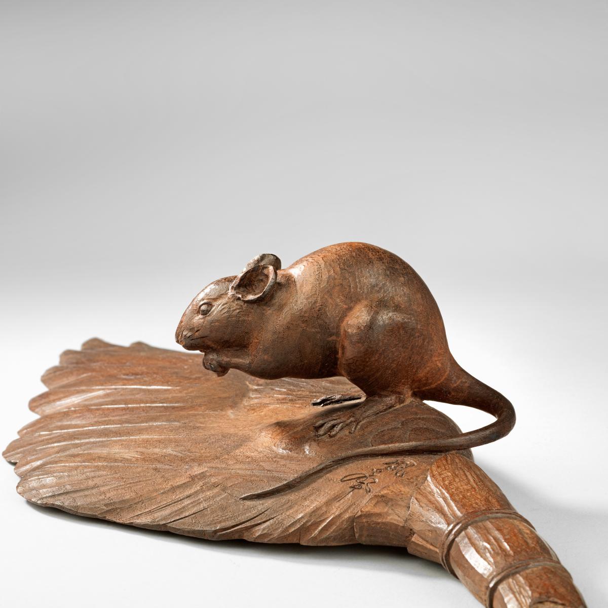 Japanese wood rat standing on a feather-brush signed Hosei, Meiji Period