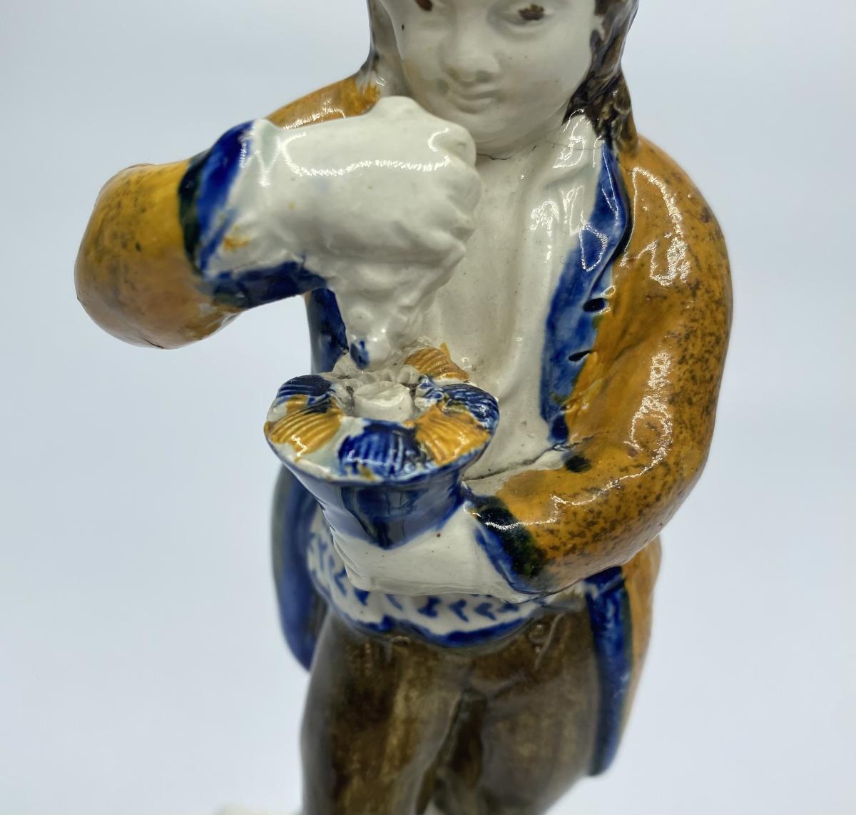Prattware pottery figure of a Vintner, Staffordshire, circa 1800