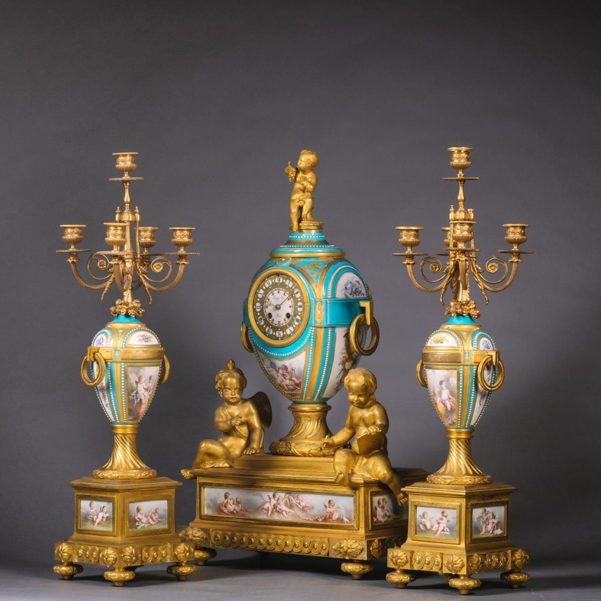A Fine Napoleon III Gilt Bronze and Porcelain Three Piece Clock Garniture By Raingo Freres for sale at Adrian Alan Ltd