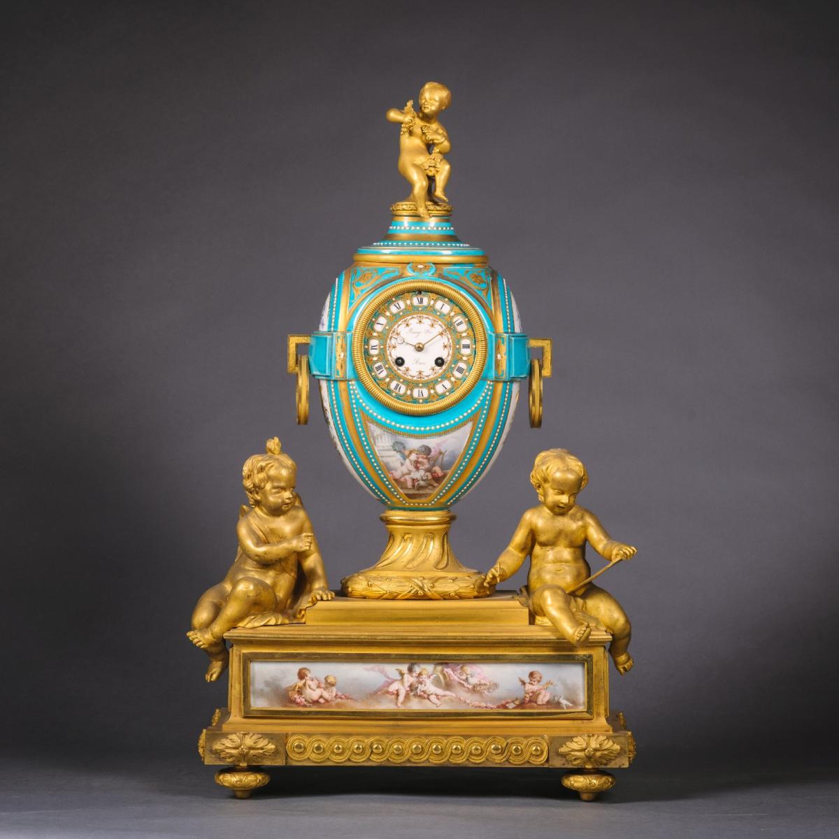 A Fine Napoleon III Gilt Bronze and Porcelain Three Piece Clock Garniture By Raingo Freres for sale at Adrian Alan Ltd