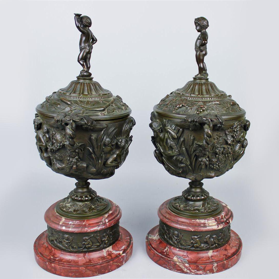 A Pair of Patinated Bronze and Rouge Griotte Marble Urns and Covers, In The Manner of Clodion